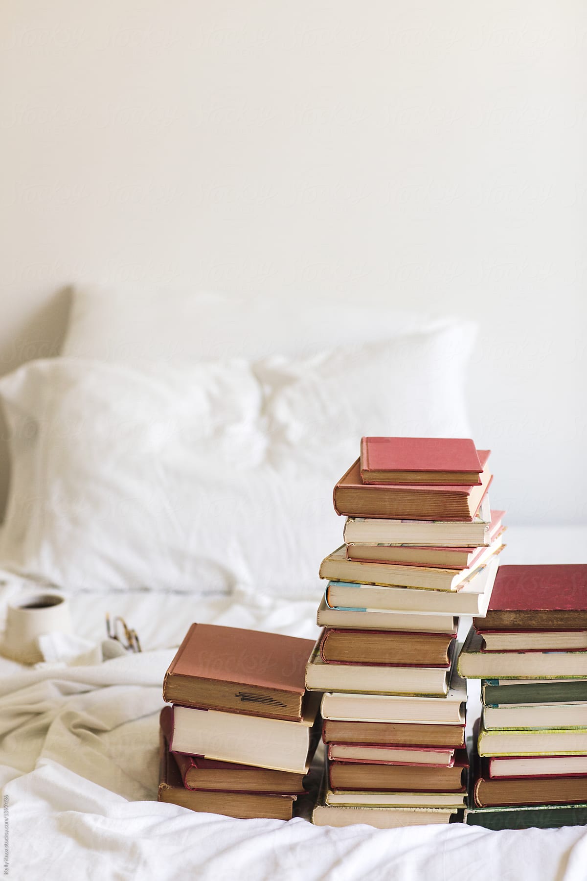 Stacks Of Books On A Bed With Copy Space Del Colaborador De Stocksy Kelly Knox Stocksy 5323