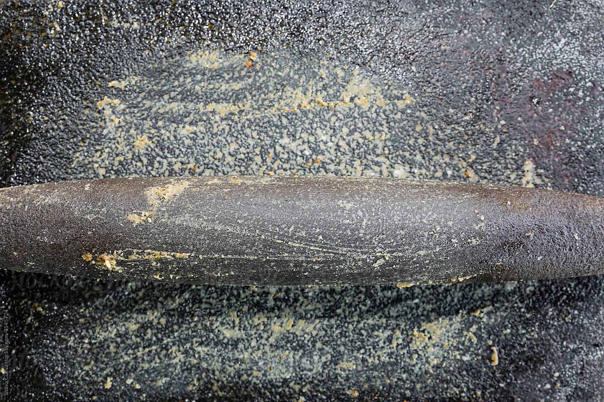 Closeup to a stone metate, traditional cooking tool