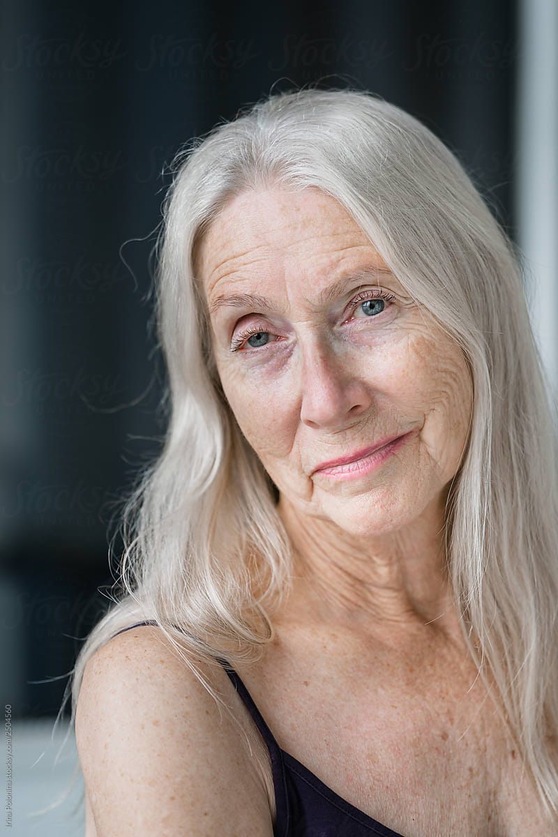 Portrait Of A Senior Woman With Grey Long Hairs By Stocksy