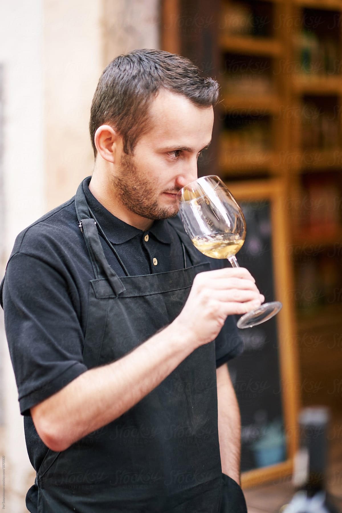 Professional sommelier testing wine