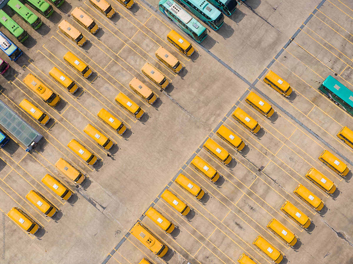 Top-down aerial view into a bus depot