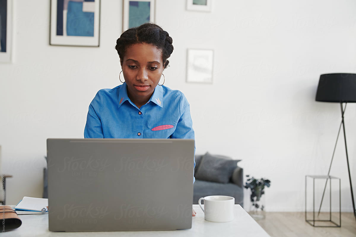 Freelance young black girl working from home