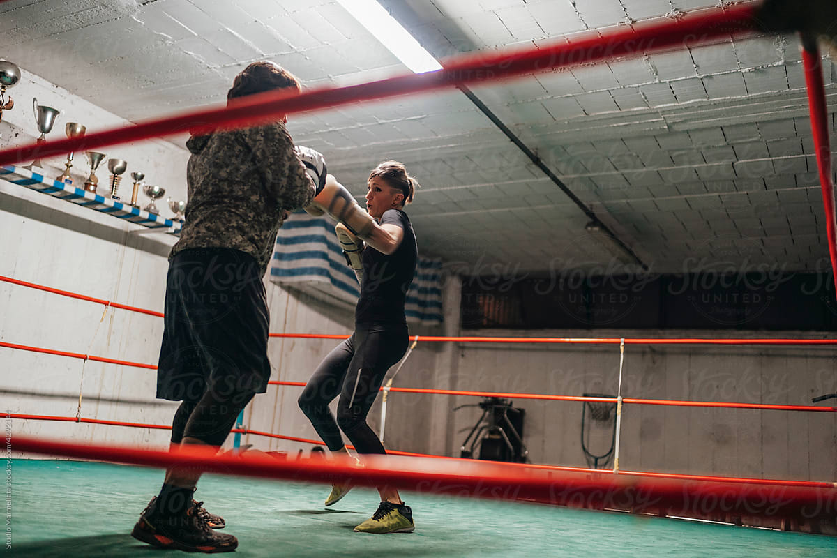 Determined boxers training in ring