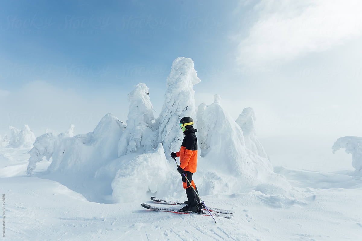 Skier on a frozen mountain peak