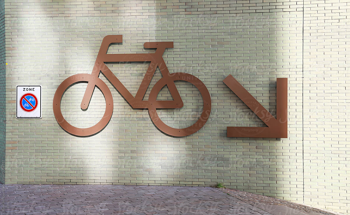 big sign for bicycle parking on wall