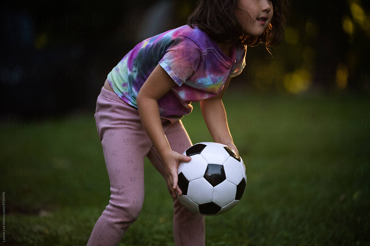 Little girl playing soccer