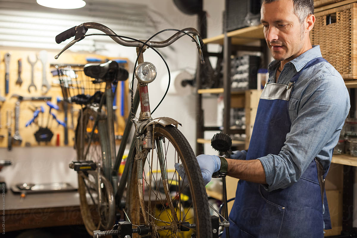 Artisan fixing a bike