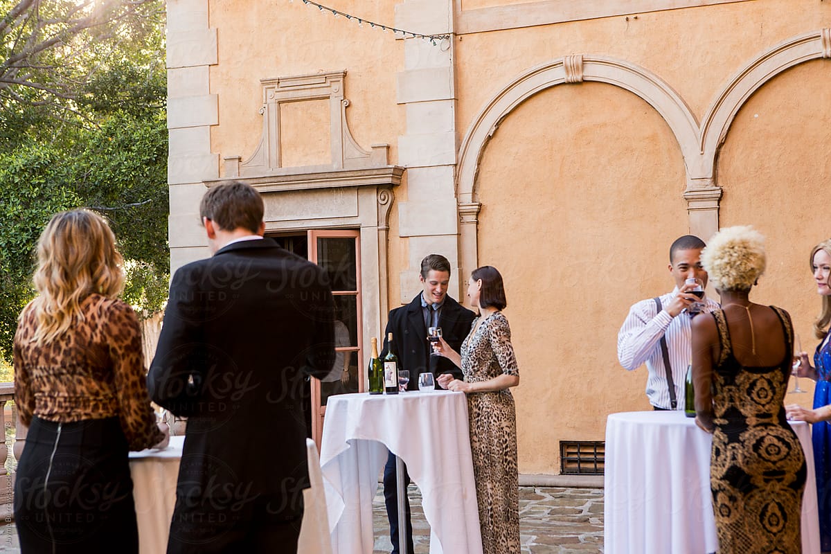 Group of People at a Formal Outdoor Party