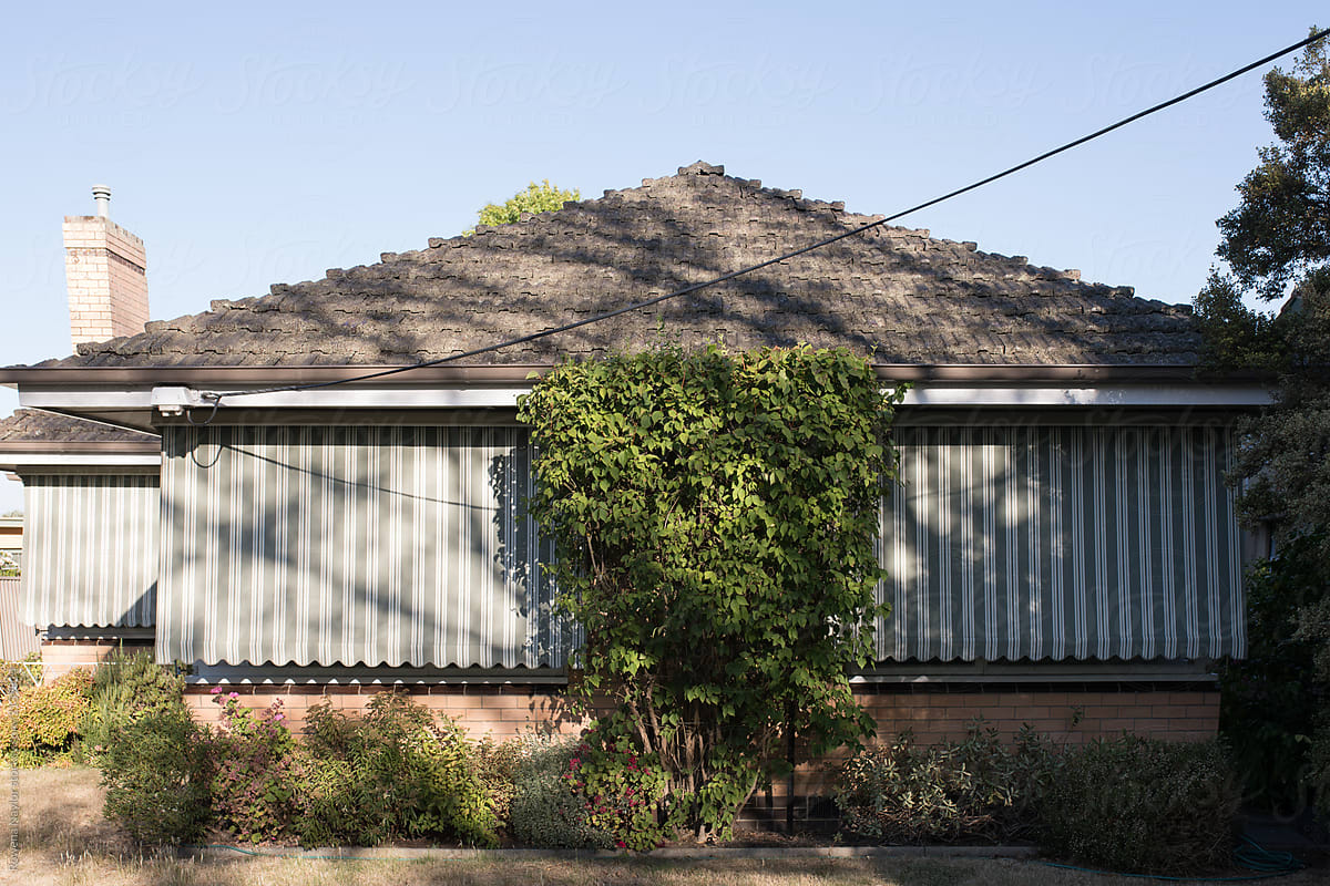Brick built suburban Australian home wth sunshades