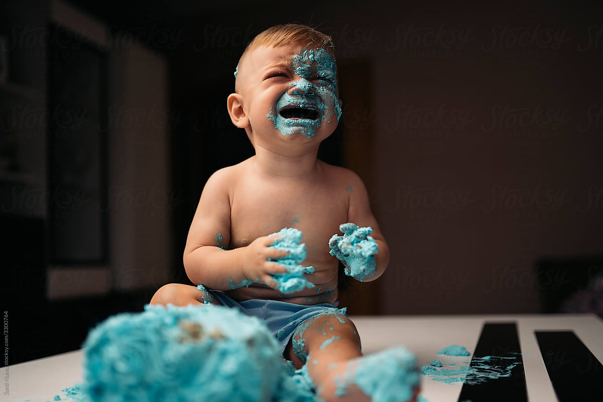 Crying Boy Eating Cake