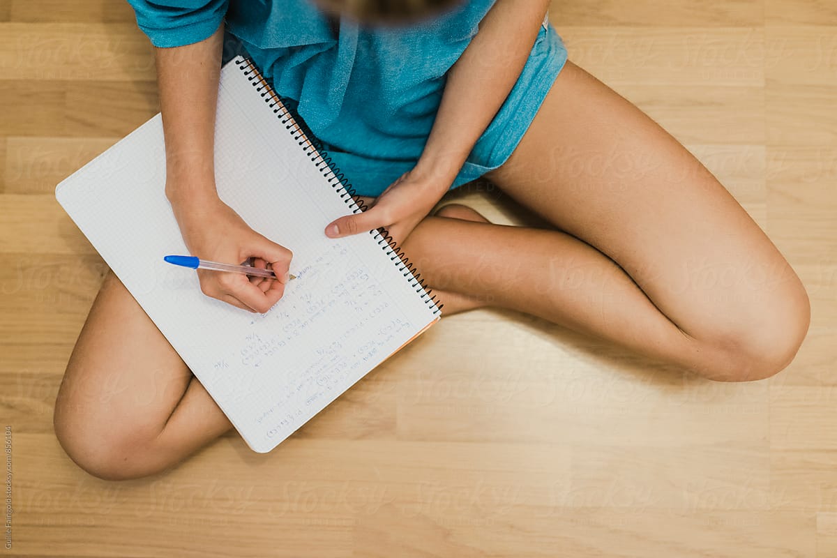 Girl writing in notebook