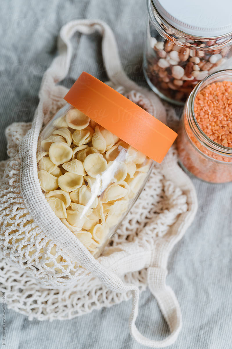 Reusable Glass Jar of Pasta in a Cloth Shopping Tote