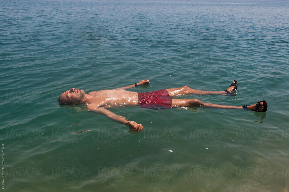 person floating in the dead sea
