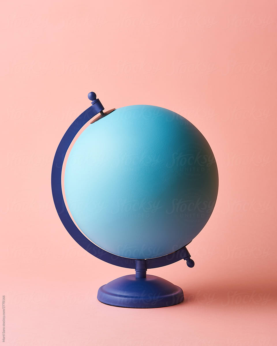 Blue Earth globe on pink background