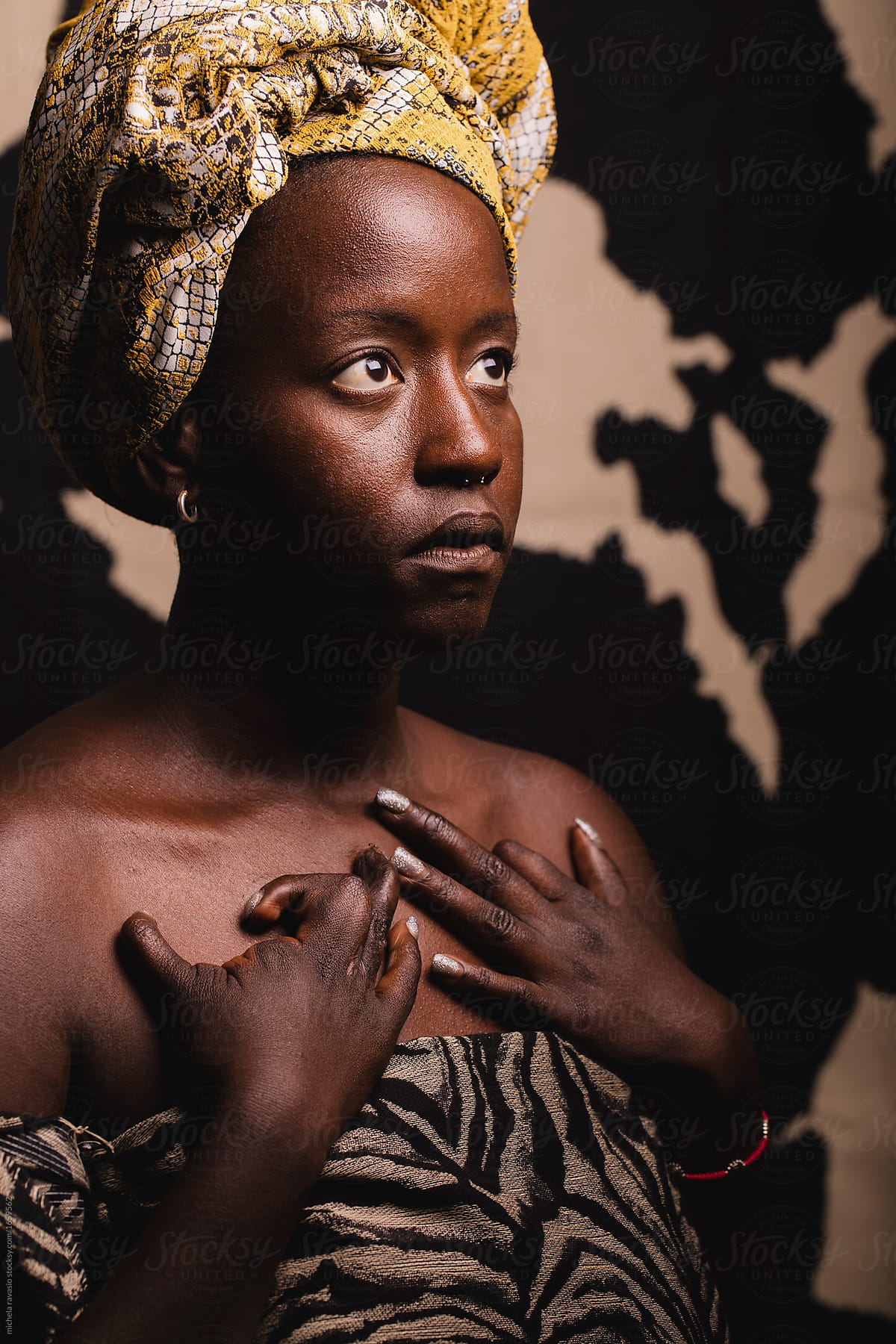 Portrait of a beautiful black girl with a congenital illness in her hands