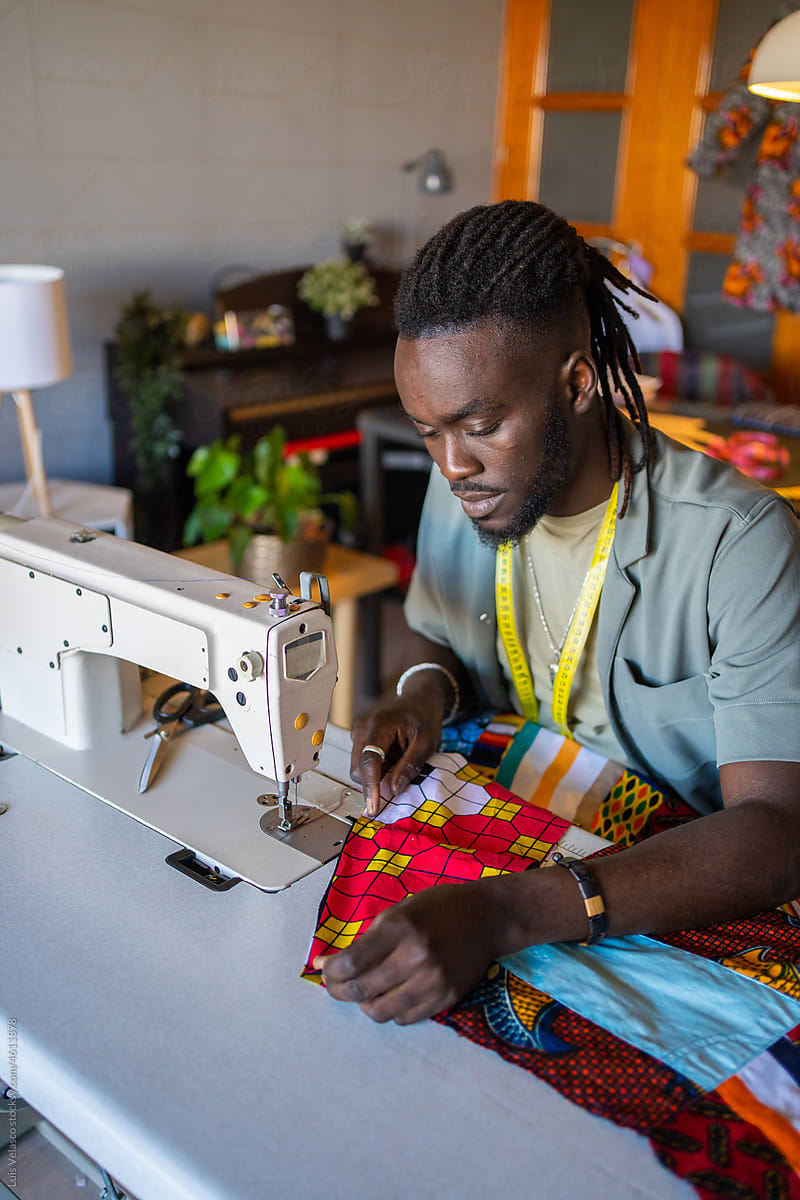 Black Man Entrepreneur Working In A Fashion Design Studio.