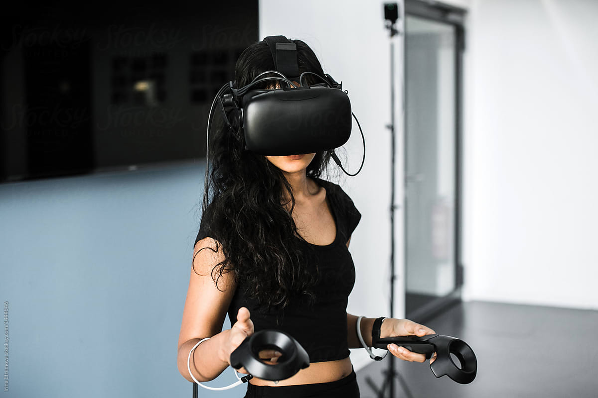 South-East asian girl playing VR game