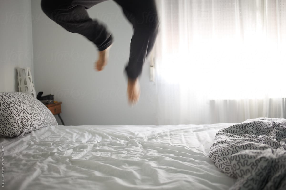 Vigorous wake up with a jump on the bed