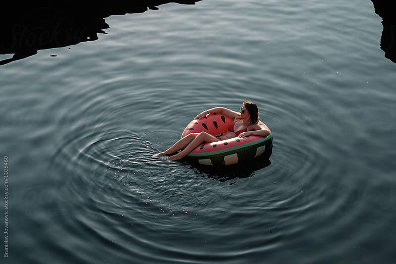 Woman Floating on Inflatable Tube in the Sea