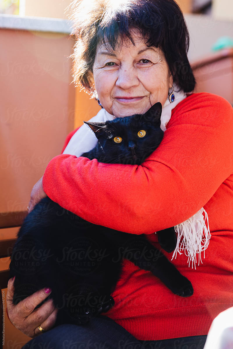 Portrait of elderly lady with cat