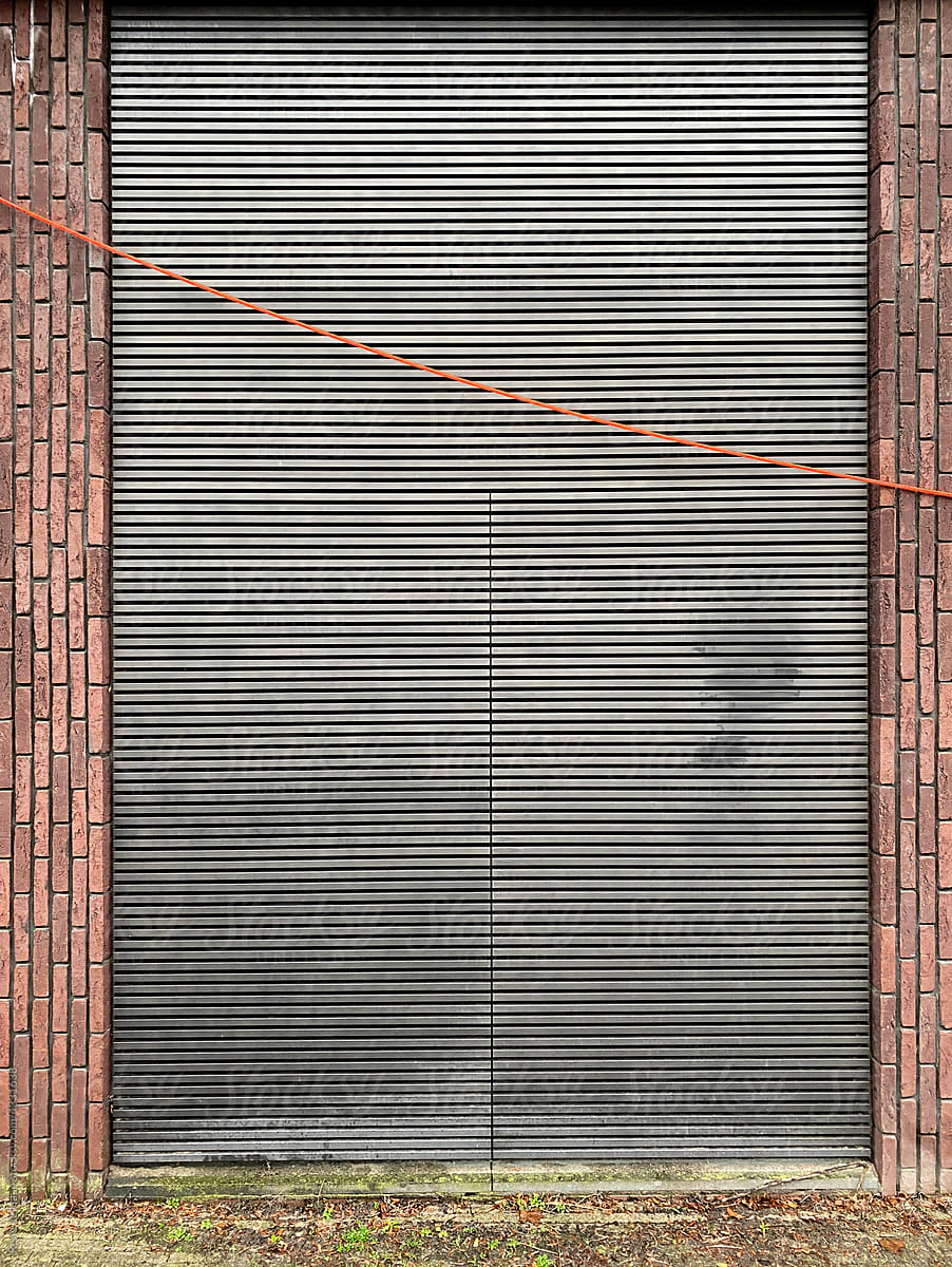brick wall with metal shutter