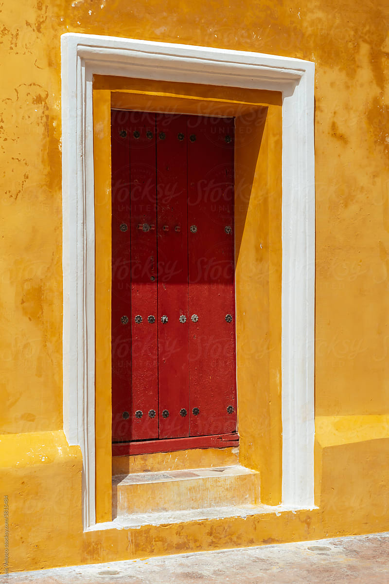 Yellow Wall And Red Door Of A Colonial Church In Campeche, Mexico.