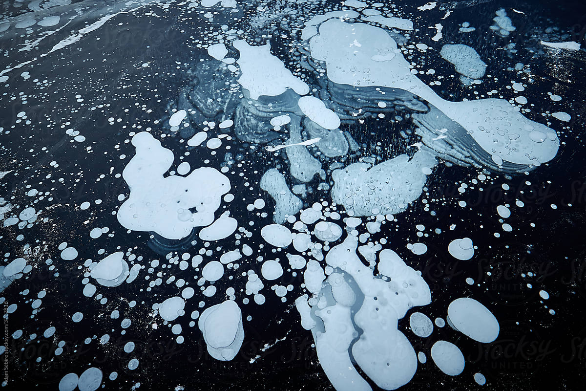 Bubbles frozen under Arctic ice - abstract patterns transparent