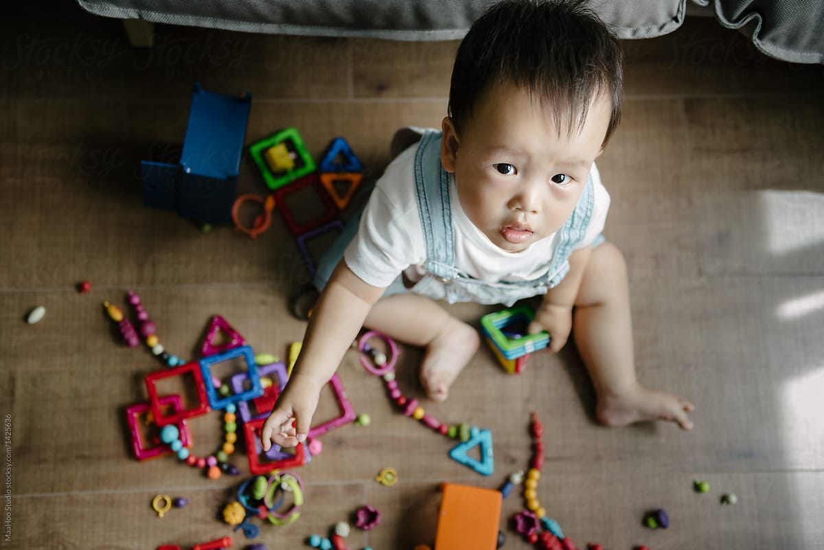 "Baby Boy Playing With Toy At Home" by Stocksy Contributor "MaaHoo ...