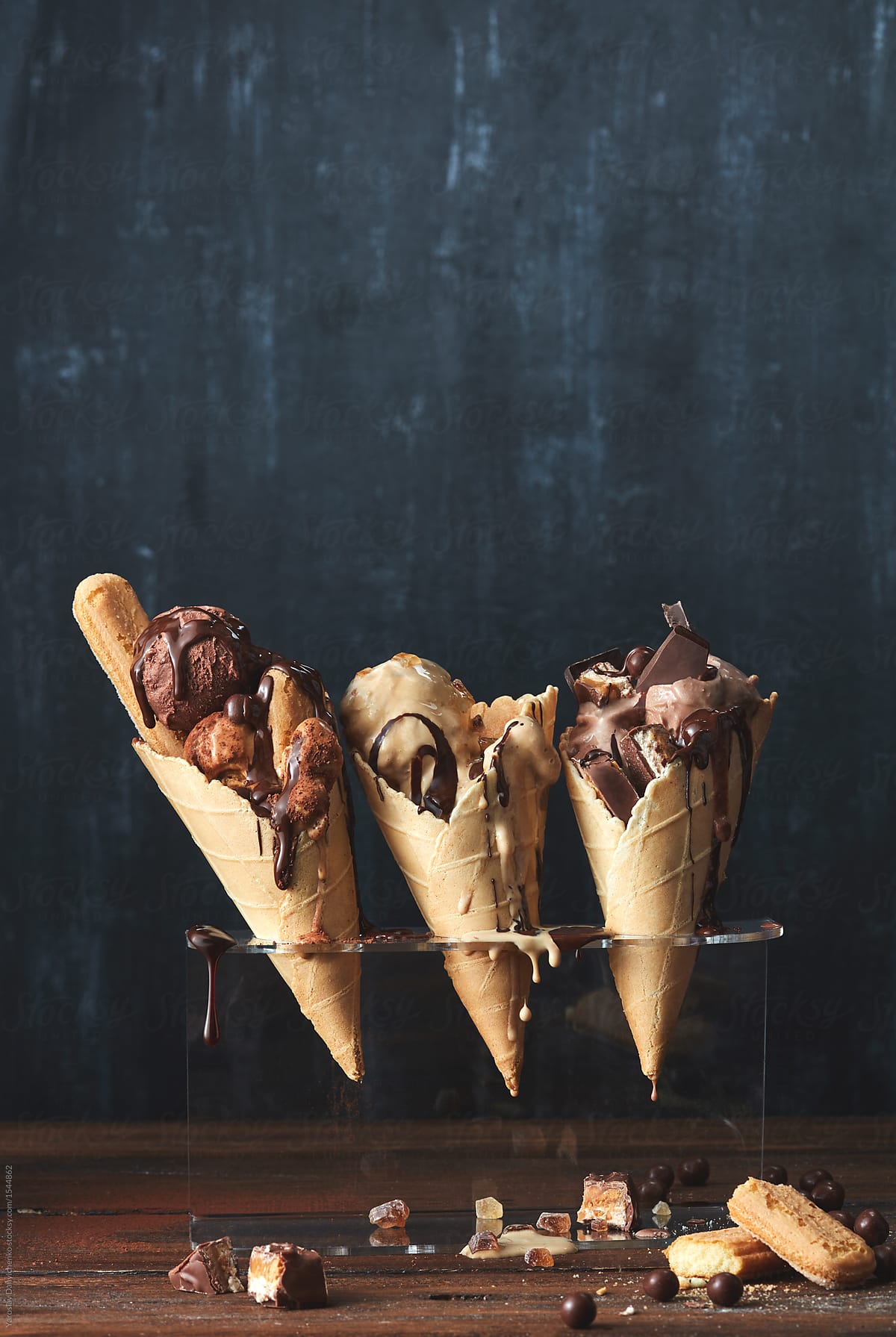on a wooden brown background Three waffle cones ice cream ,