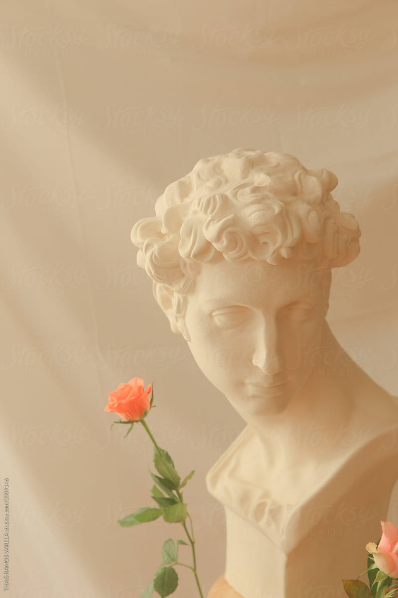 greek statue and roses.