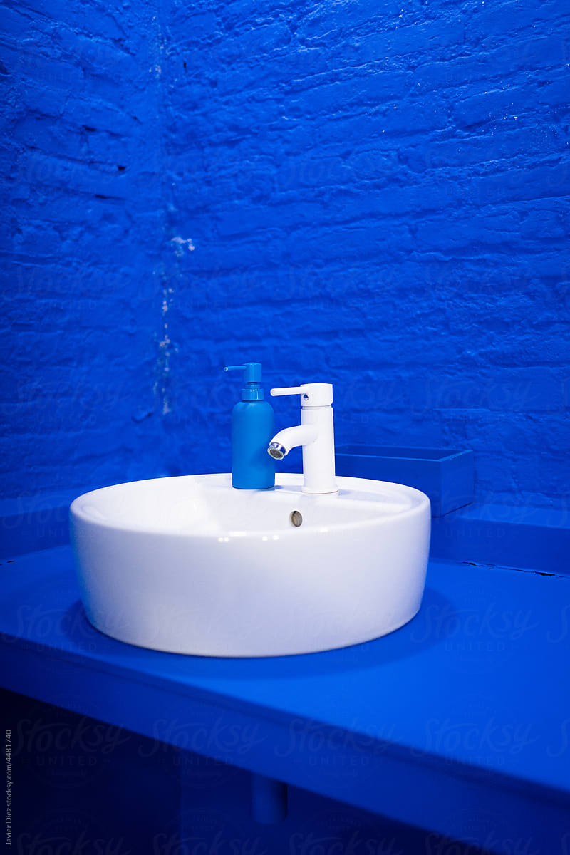 Interior of modern lavatory with blue walls
