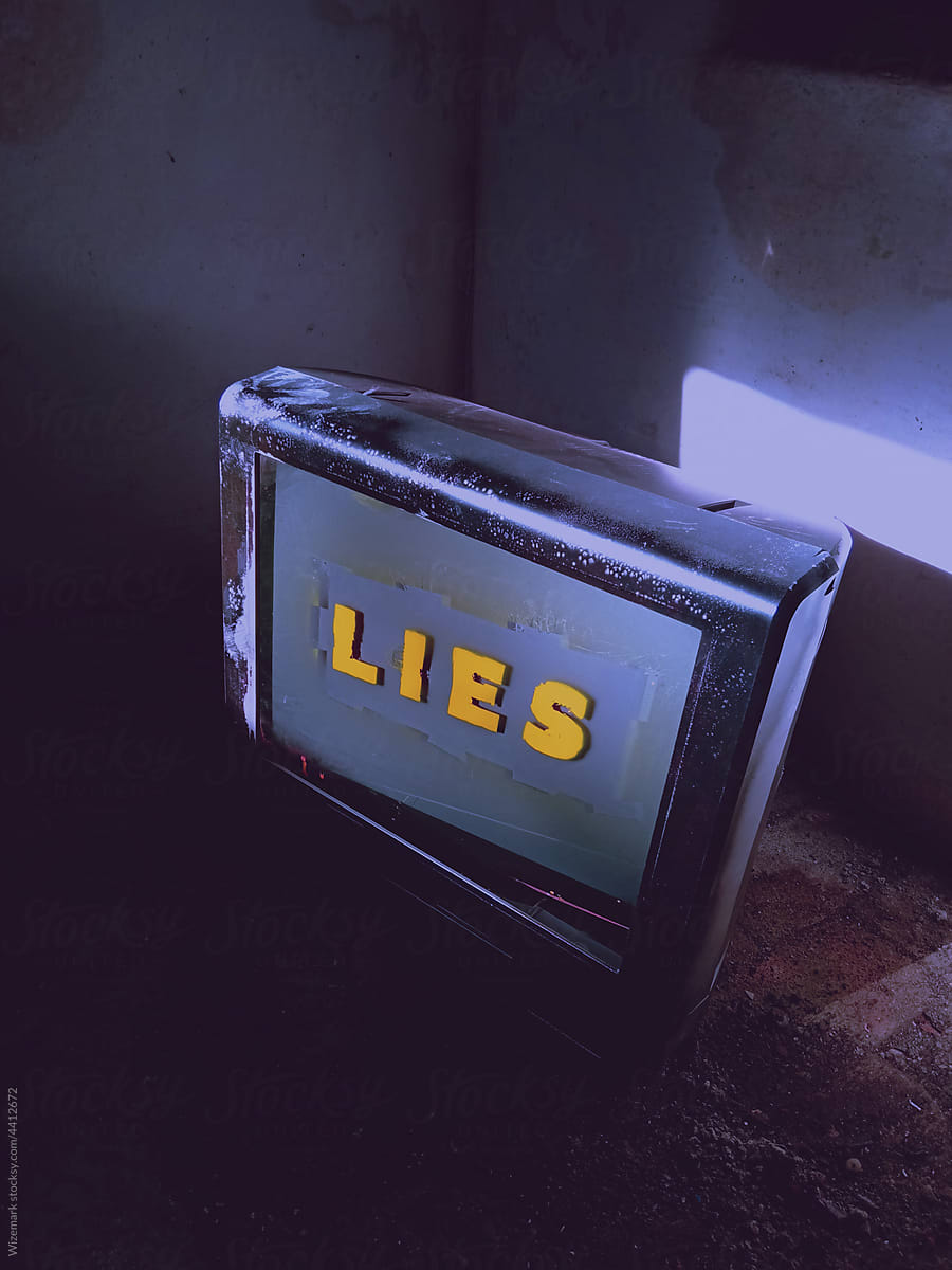 Old TV set showing LIES message
