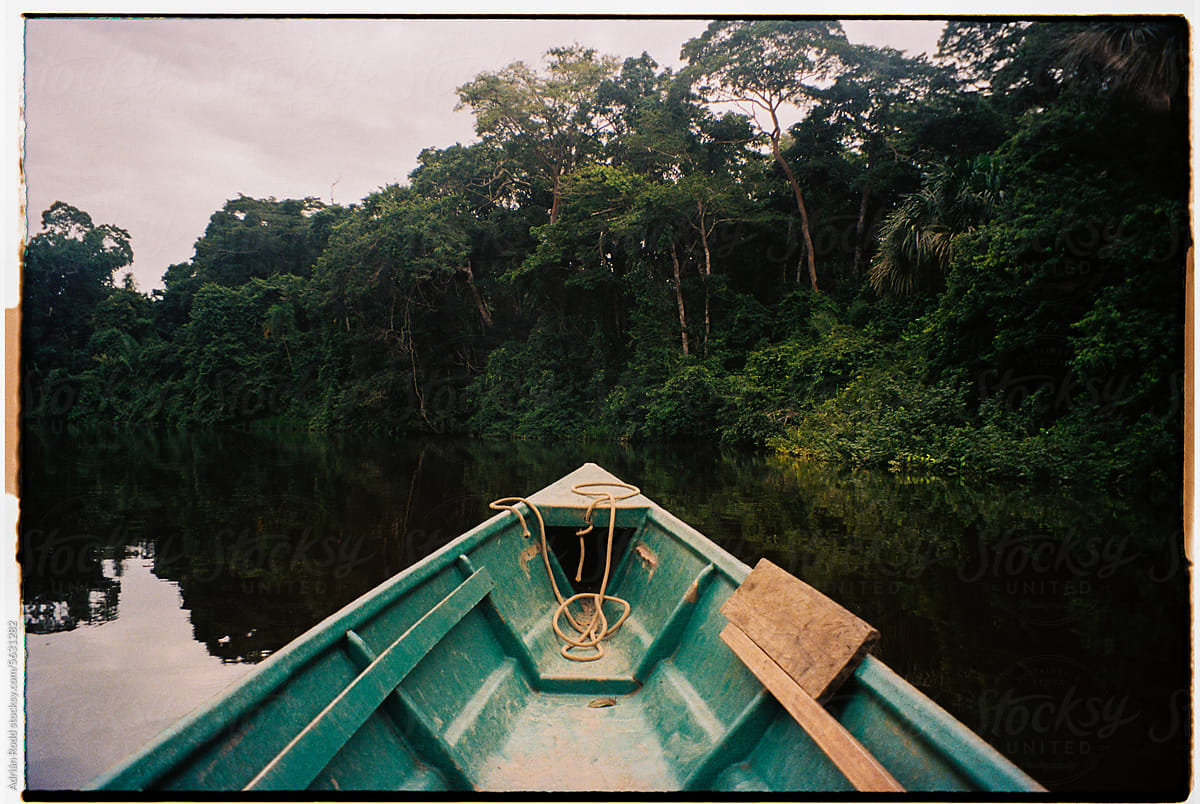 Close-Up of a Canoe Sailing Alongside in the Peruvian Jungle