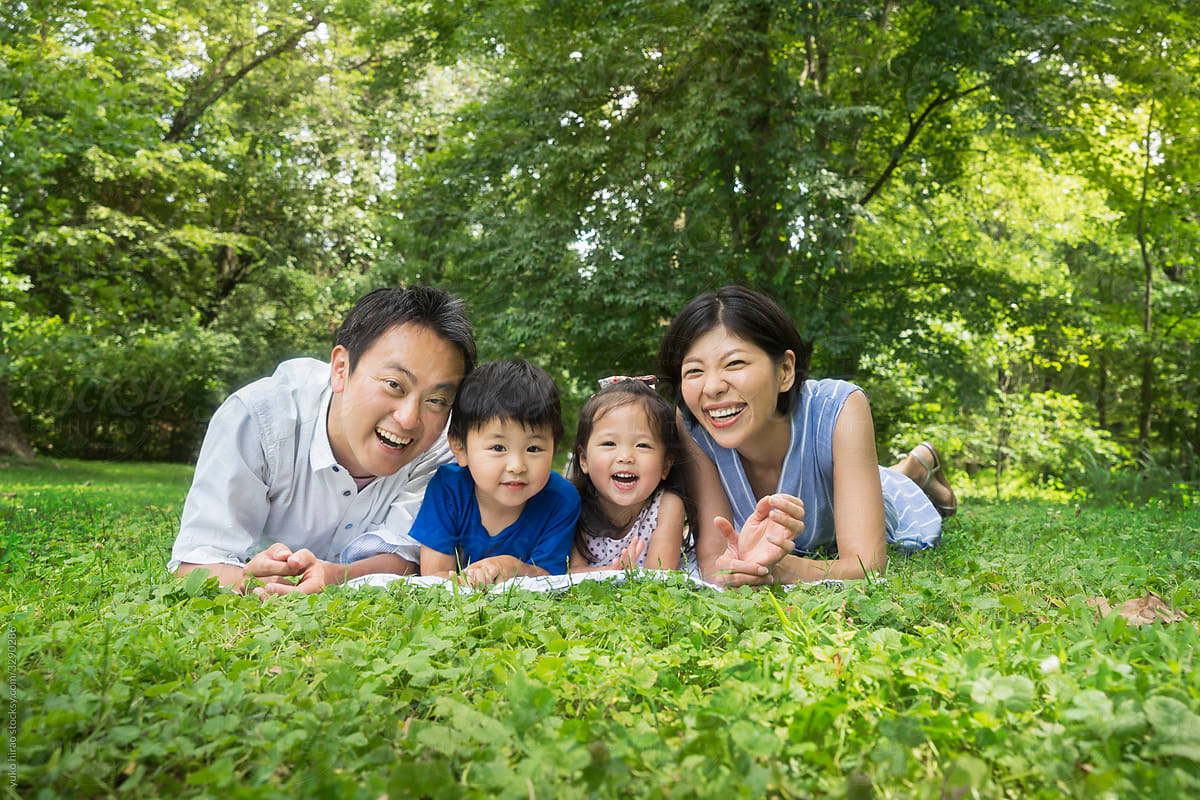 Smiley\
 Asian family summer portrait on the grass