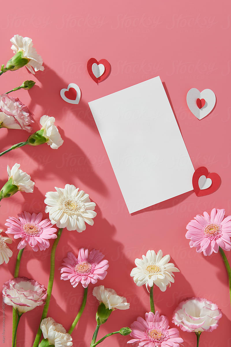 Happy Valentine's Day concept with paper hearts and gerbera flowers