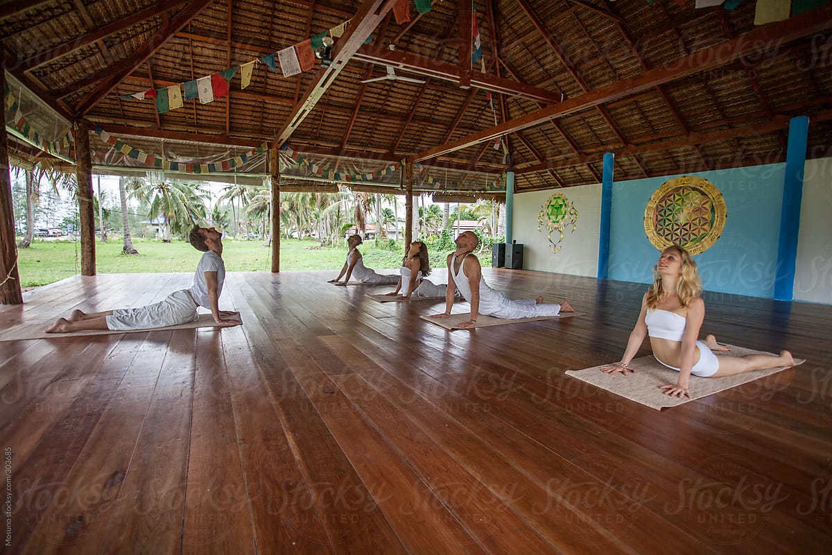 Yoga Class In A Beautiful Hall Made Of Bamboo by Stocksy
