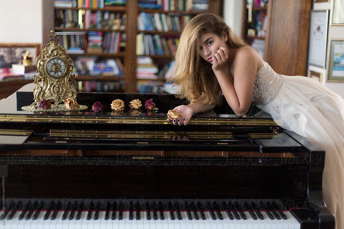 Young, beautiful and talented piano player Naomi
