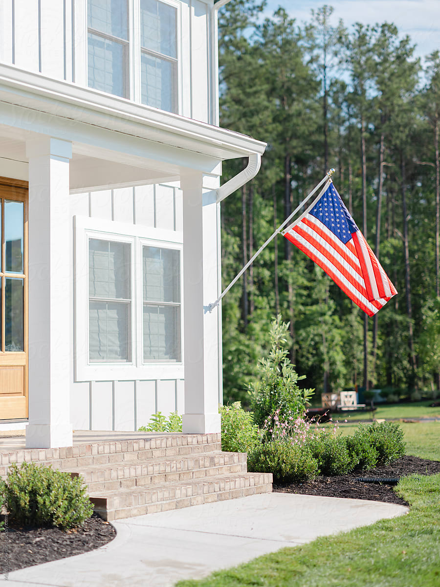 American flag on a modern farmhouse