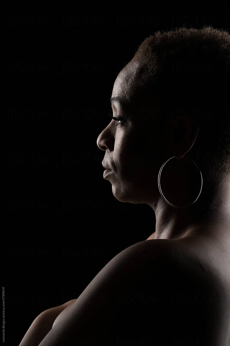 Portrait of an afro woman on black background