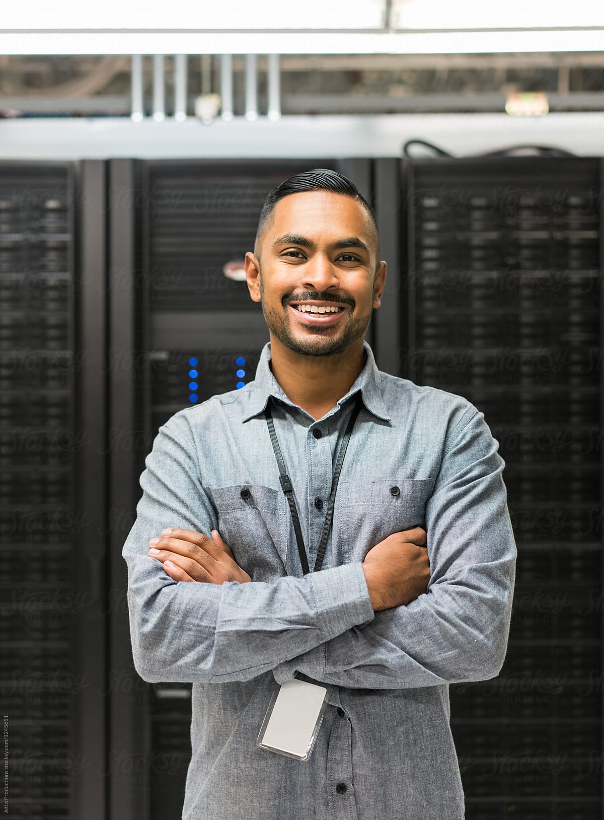 Portrait of a smiling server room technician