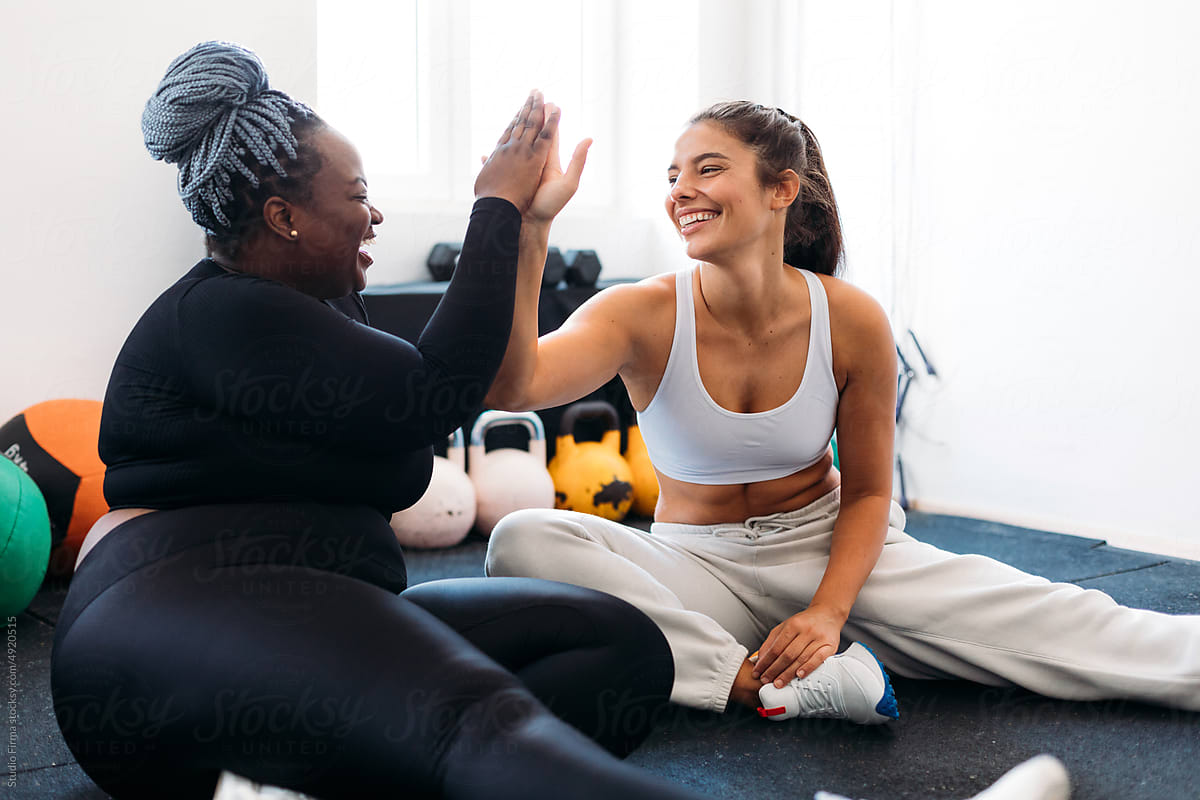 Two Women Supporting Each Other in Gym