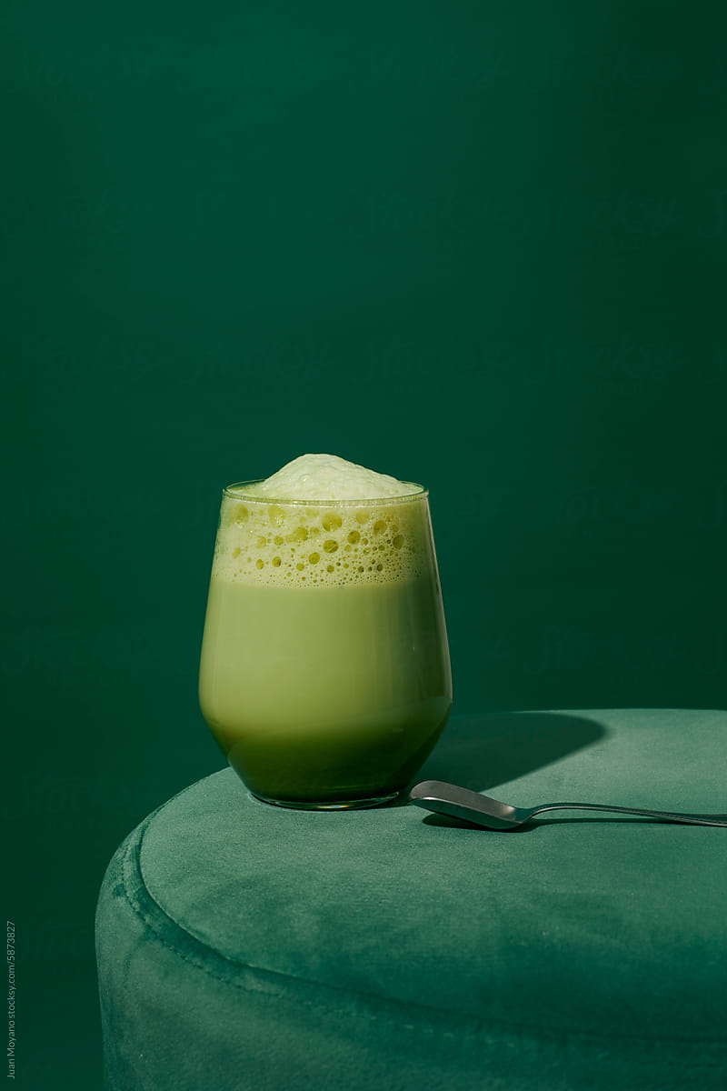 glass with iced matcha latte