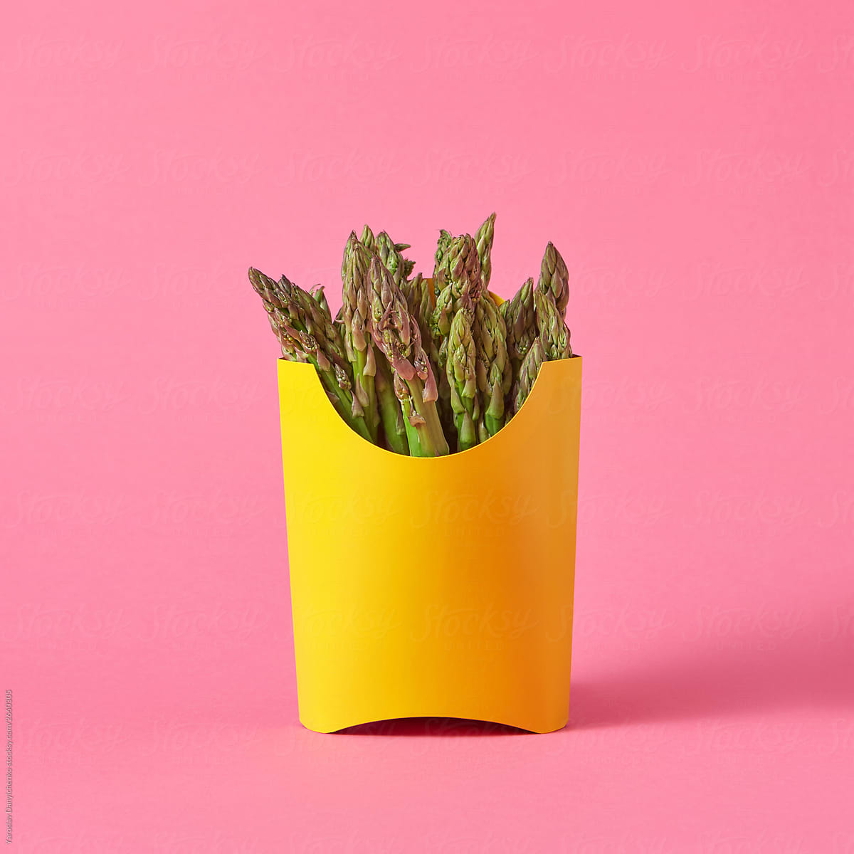Natural asparagus in a paper container.