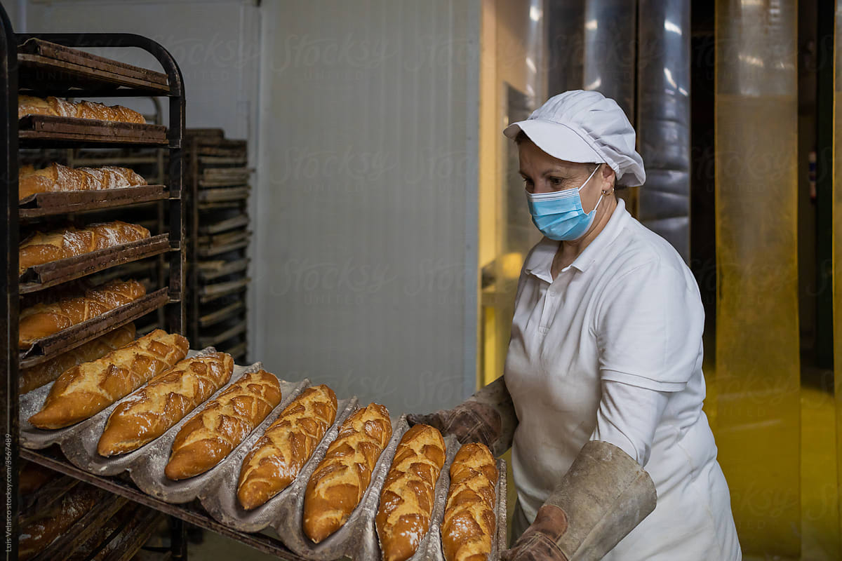 Woman Working In A Bread Factory.