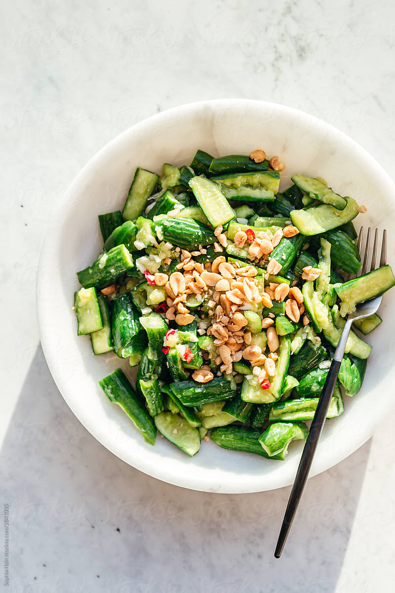 smashed cucumber salad in marble bowl