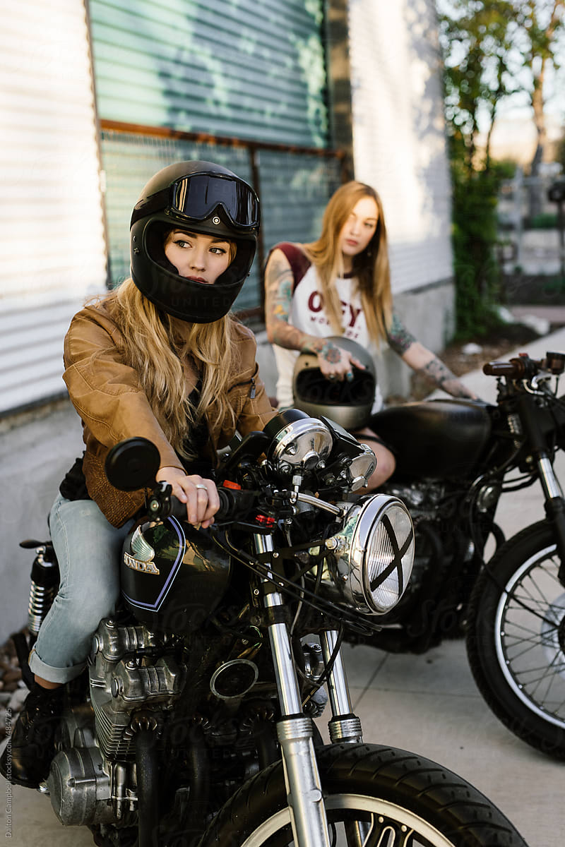 Attractive girls riding vintage motorcycles