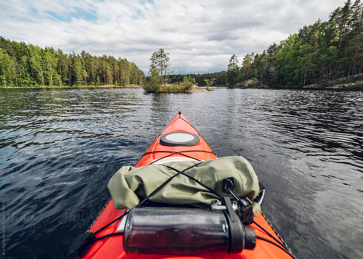 Kayaking on a calm lake of Finland