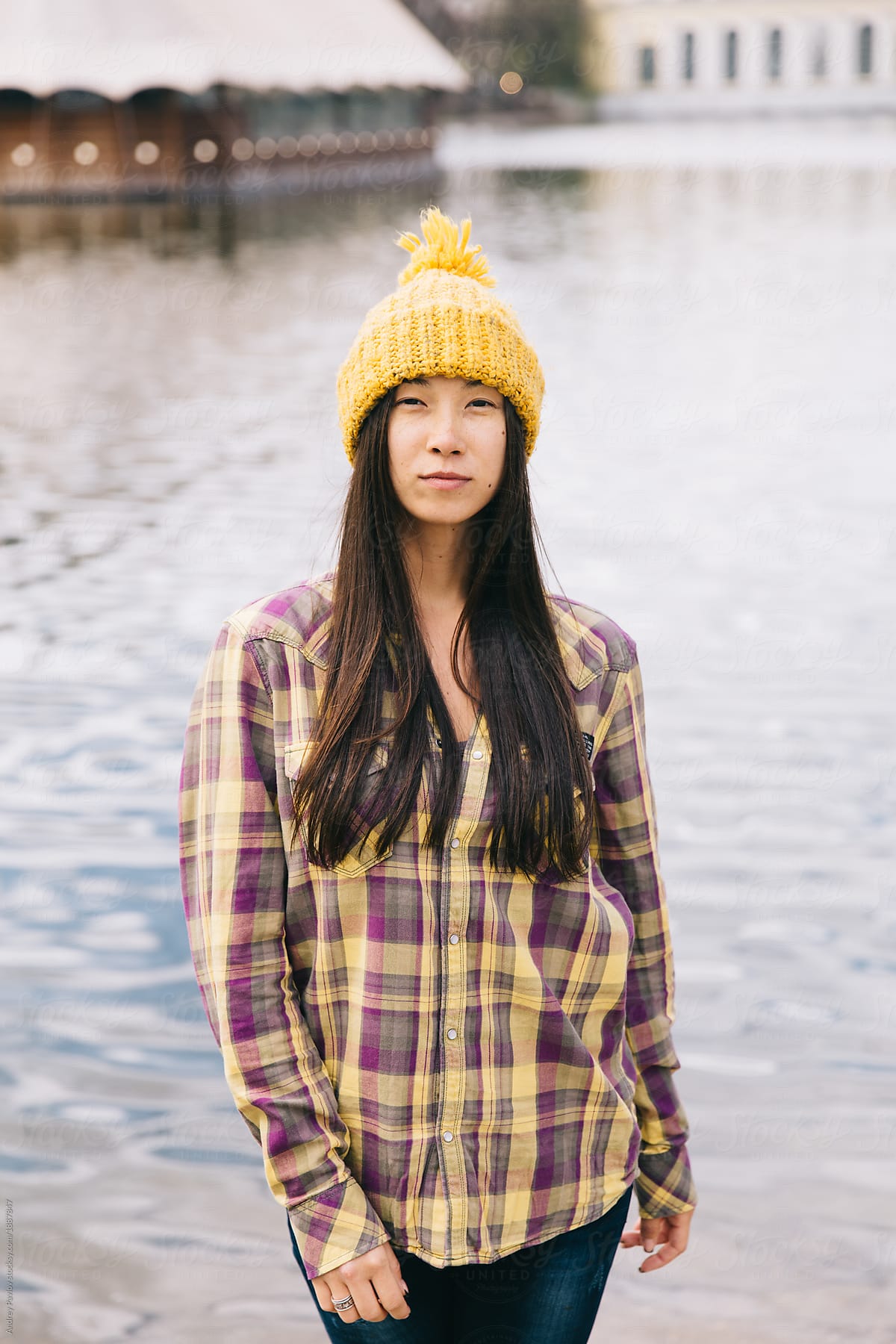 Portrait of a woman in knitted yellow hat and shirt