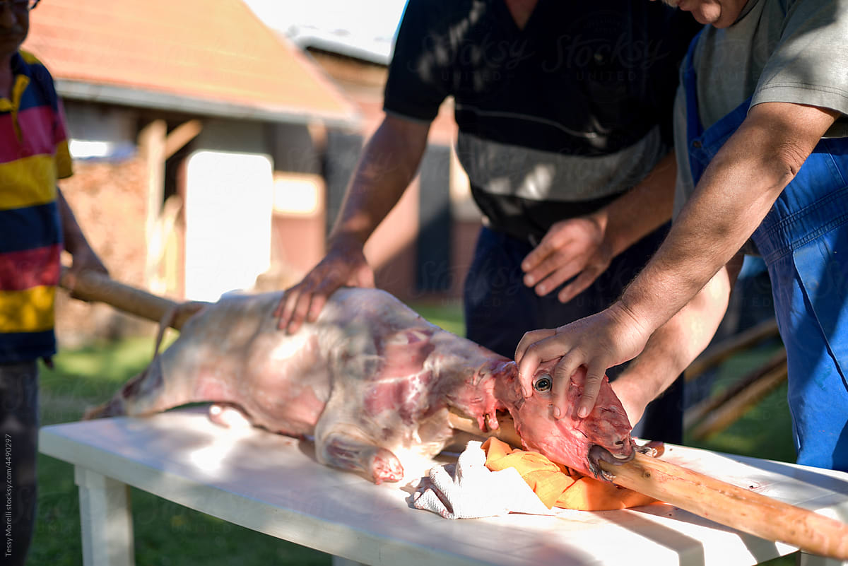 Old friends preparing the lamb for a traditional holiday