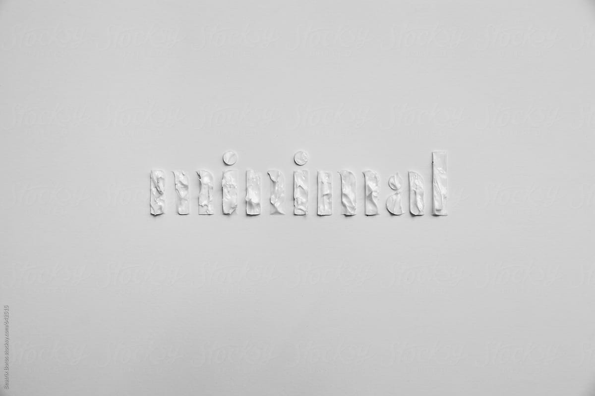 Word minimal written with white paint on a simple white background